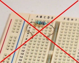 Resistor on a breadboard (wrong connection)